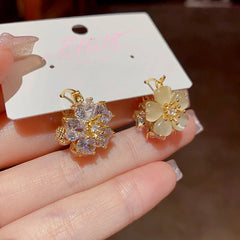 Close-up detail of the sparkling zircons and plating on the Double-Sided Flower Earrings