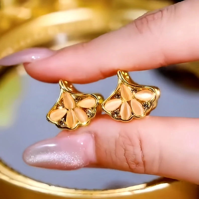 Angled view of the 14K Gold-Plated Zircon Cat's Eye Ginkgo Leaf Earrings