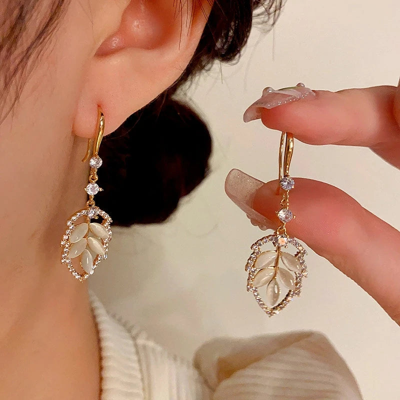 Close-up detail of the sparkling zircons and plating on the Leaf Ear Hooks