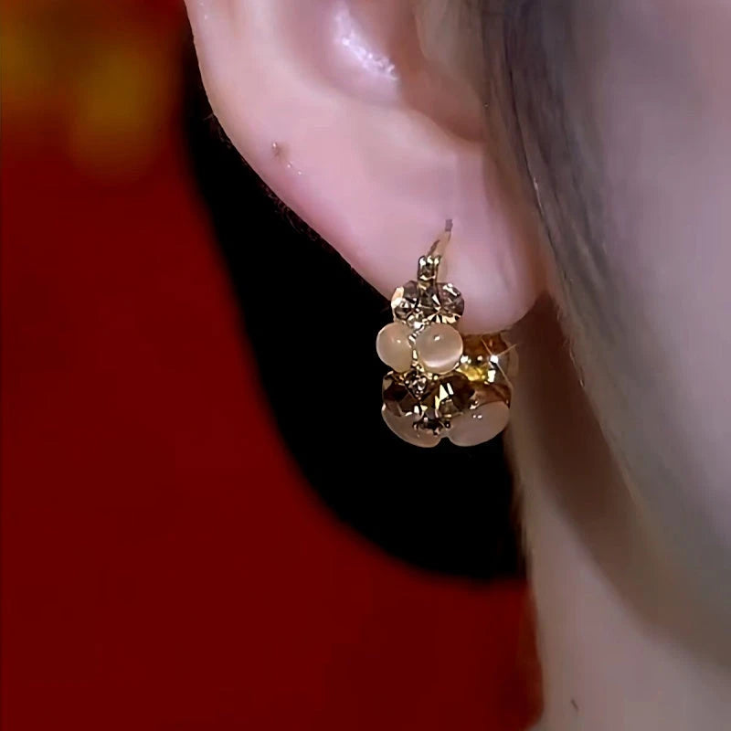 Close-up detail of the sparkling zircons and plating on the Stone Basket Earrings