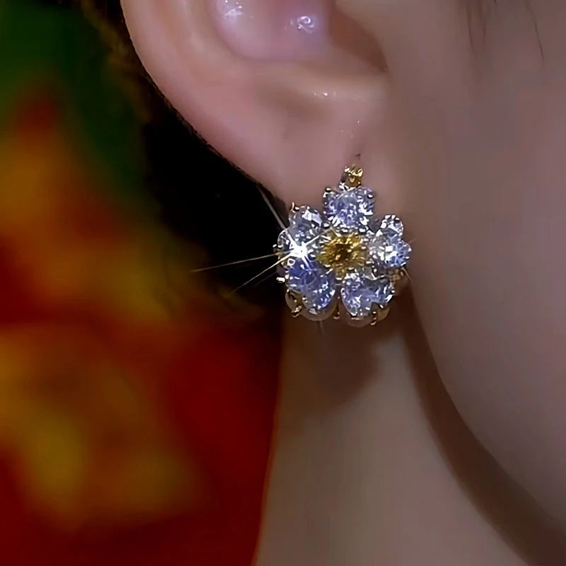 Close-up detail of the sparkling zircons and plating on the Cat's Eye Flower Earrings