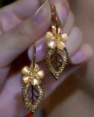 Close-up detail of the sparkling zircons and plating on the Golden Flower Earrings
