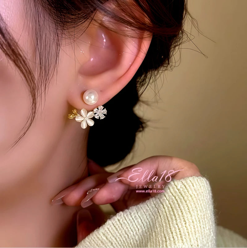 Close-up detail of the sparkling zircons and plating on the Flower Pearl Jacket Earrings