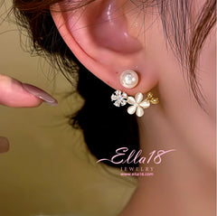 Model showcasing the dangle and style of the 14K Gold-Plated Zircon Cat's Eye Stone Flower Pearl Earrings