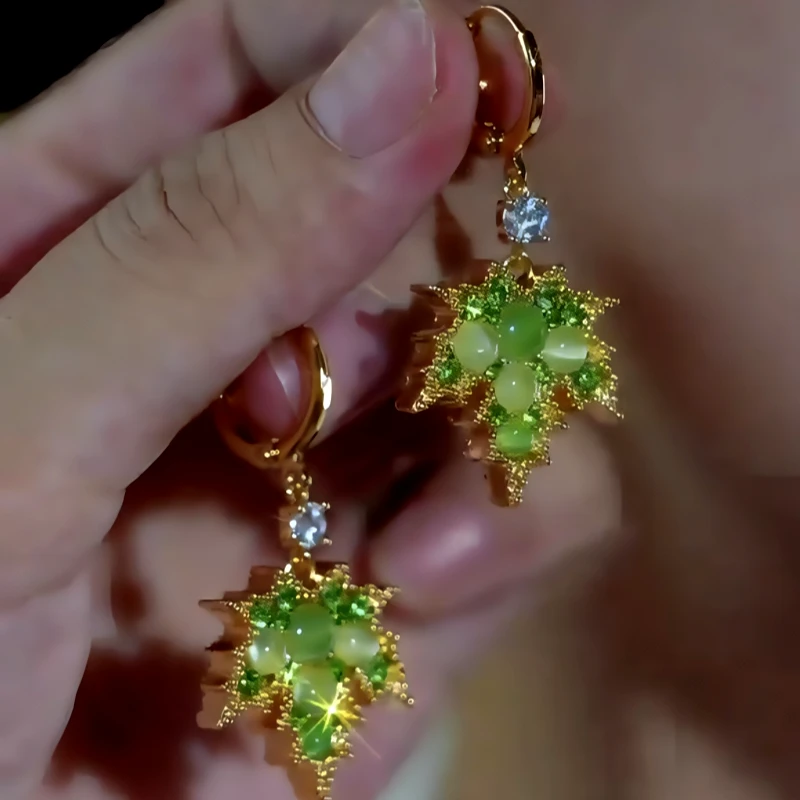 Close-up detail of the sparkling zircons and plating on the Maple Leaf Earrings