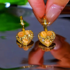 Angled view of the 14K Gold-Plated Zircon Cat's Eye Stone Heart Earrings