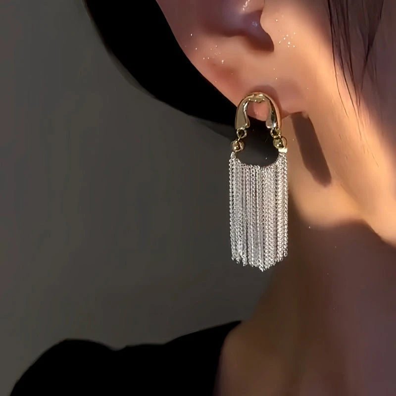 Model showcasing the dangle and style of the 14K Gold-Plated Zircon Chain Tassel Earrings
