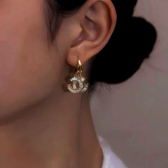 Angled view of the 14K Gold-Plated Zircon Chanel Style Double C Earrings