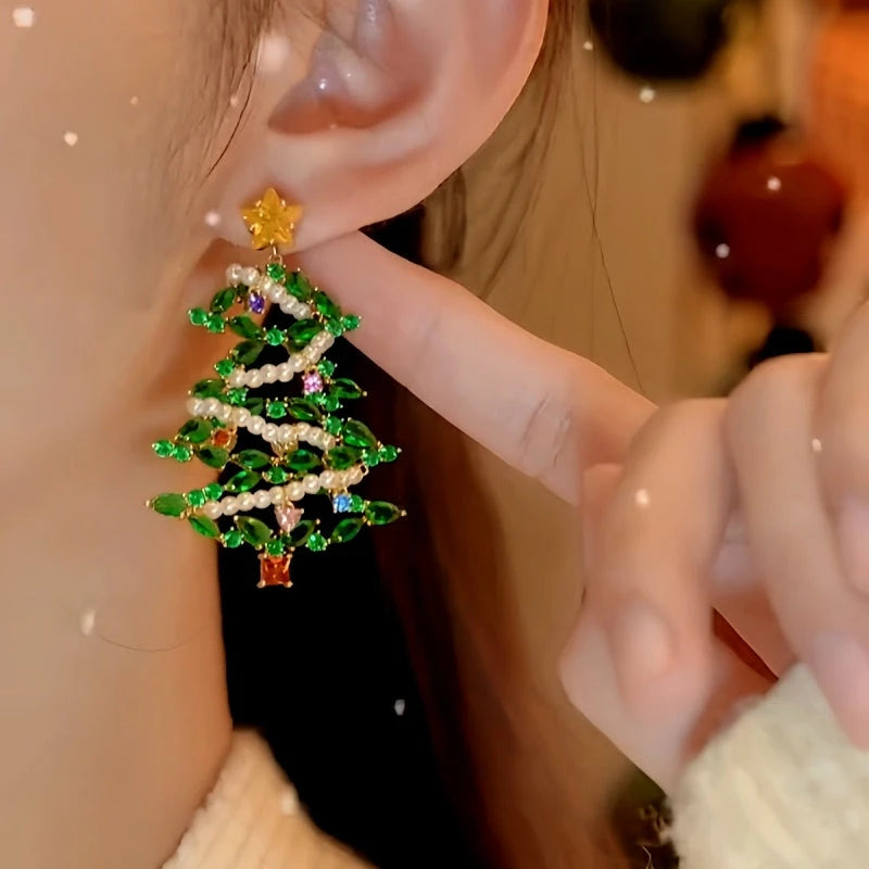 Model showcasing the dangle and style of the 14K Gold-Plated Zircon Christmas Diamond Pearl Forest Tree Earrings