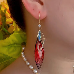 Close-up detail of the sparkling zircons and plating on the Colored Feather Earrings