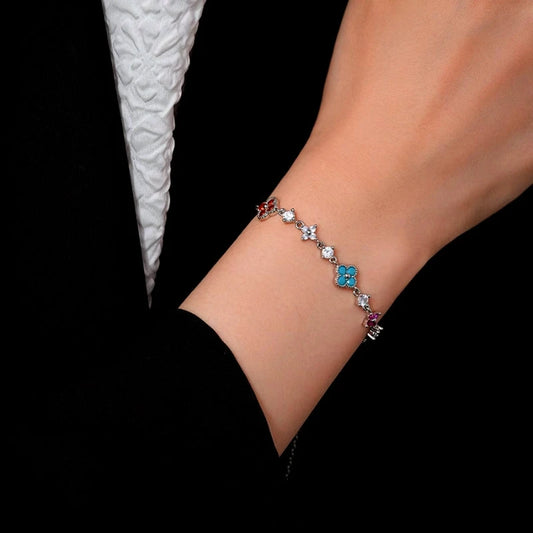 Model wearing the 14K Gold-Plated Zircon Colorful Flower Bracelets to highlight its design on the wrist