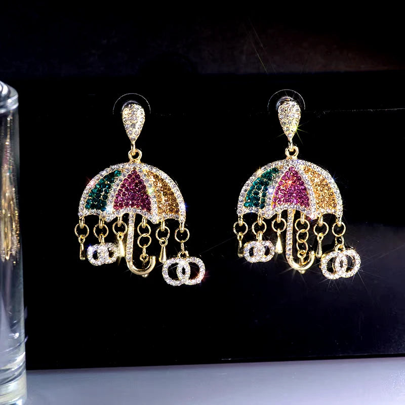 Close-up detail of the sparkling zircons and plating on the Umbrella Tassel Earrings