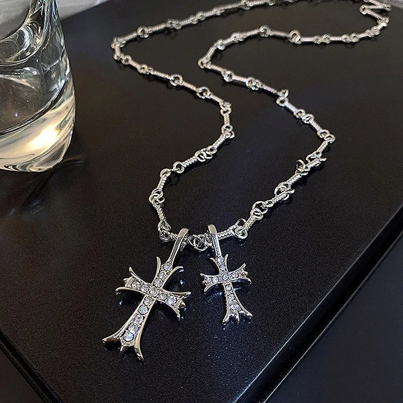 Close-up of the pendant and clasp on the Silver Cross Necklace