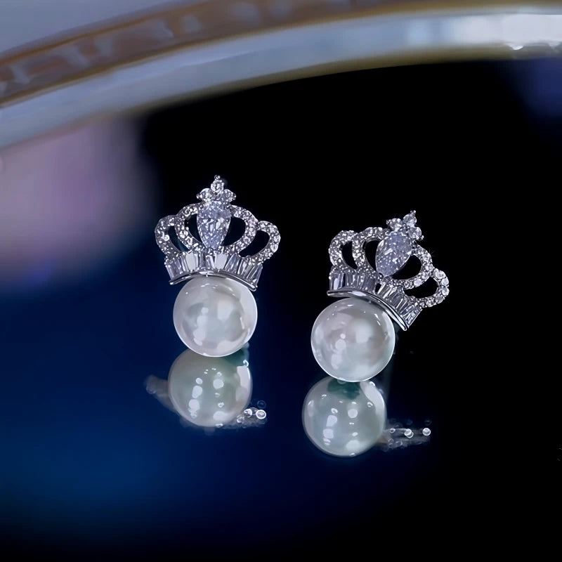 Angled view of the 14K Gold-Plated Zircon Crown Pearl Earrings
