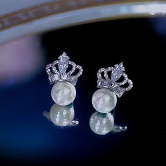 Angled view of the 14K Gold-Plated Zircon Crown Pearl Earrings