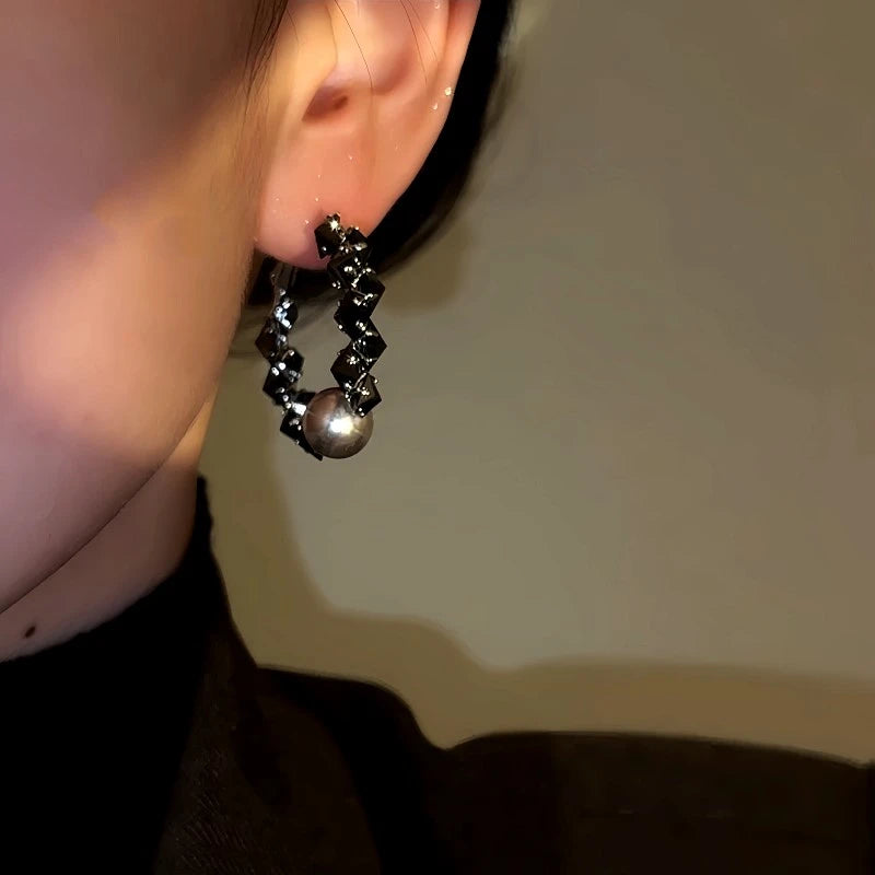 Model showcasing the dangle and style of the 14K Gold-Plated Zircon Crystal Bead Earrings