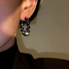 Model showcasing the dangle and style of the 14K Gold-Plated Zircon Crystal Bead Earrings