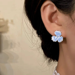 Close-up detail of the sparkling zircons and plating on the Blue Flower Earrings