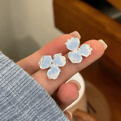 Angled view of the 14K Gold-Plated Zircon Crystal Flower Earrings