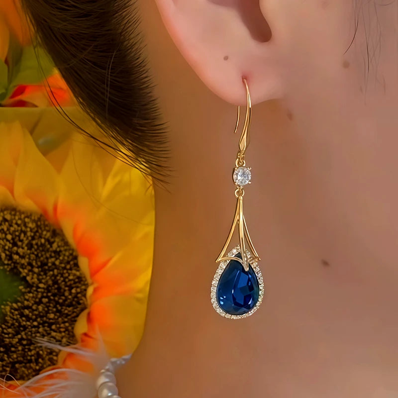 Model showcasing the dangle and style of the 14K Gold-Plated Zircon Crystal Tassel Earrings