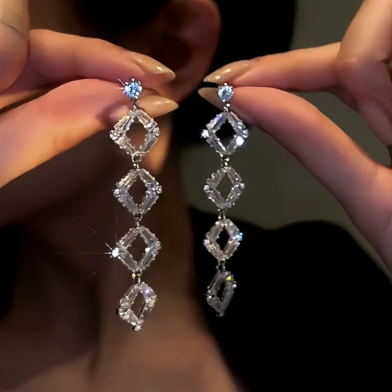 Model showcasing the dangle and style of the 14K Gold-Plated Zircon Crystal Tassel Earrings