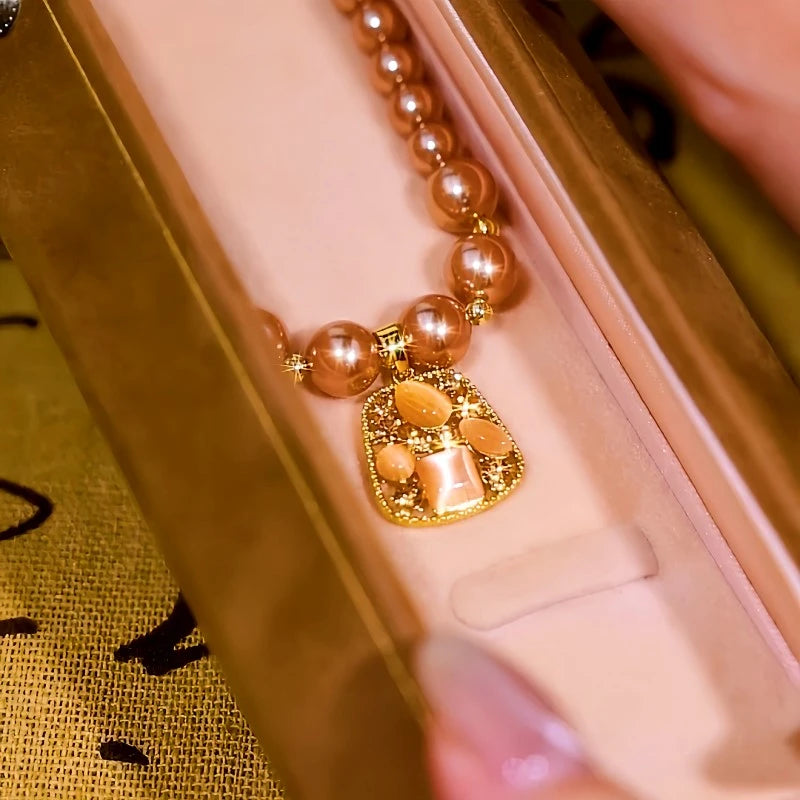 Close-up of the pendant and clasp on the Square Pearl Necklace