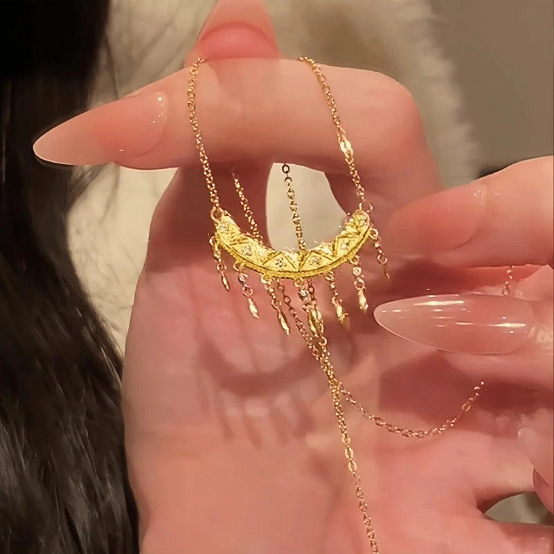 Close-up of the pendant and clasp on the Crescent Tassel Necklace