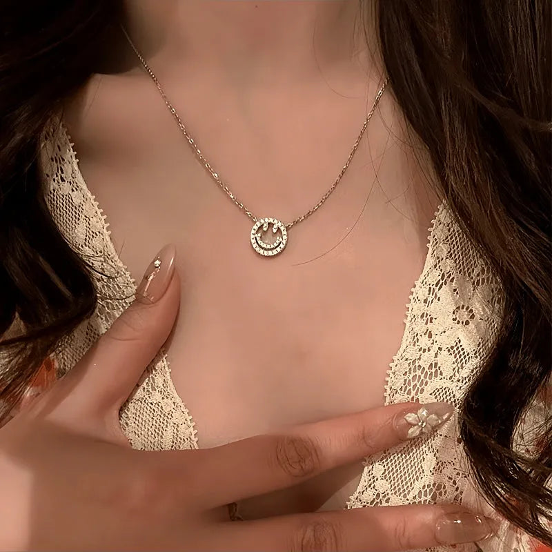 Detailed view of the 14K Gold-Plated Zircon Diamond-Studded Hollow Smiley Face Necklace chain and pendant