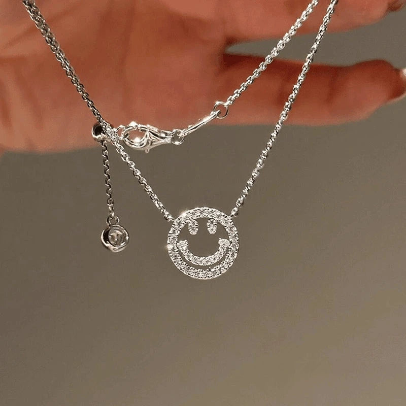Close-up of the pendant and clasp on the Hollow Smiley Necklace