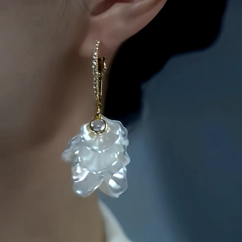 Close-up detail of the sparkling zircons and plating on the White Petal Earrings