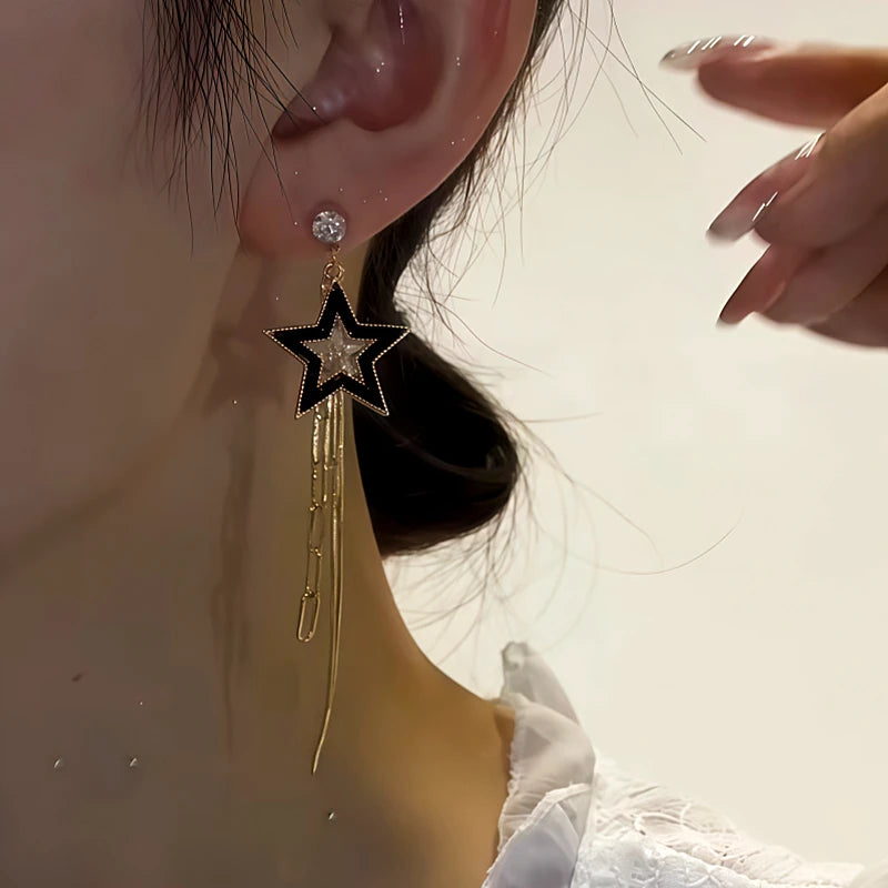 Model showcasing the dangle and style of the 14K Gold-Plated Zircon Diamond Asymmetrical Five-Star Earrings