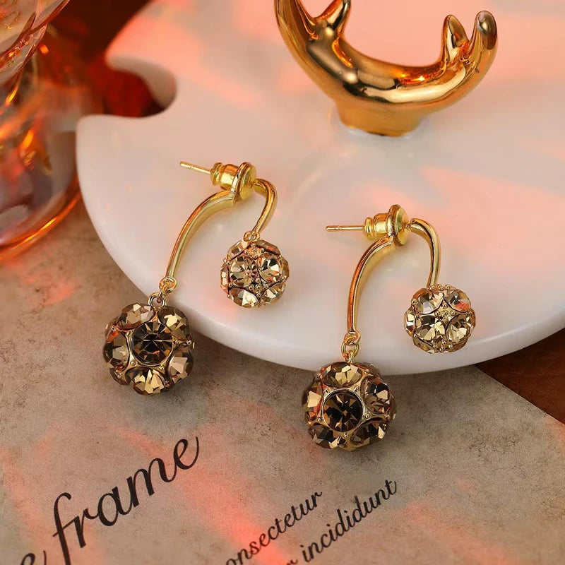 Detailed view of the sparkling accents on the Purple Ball Earrings