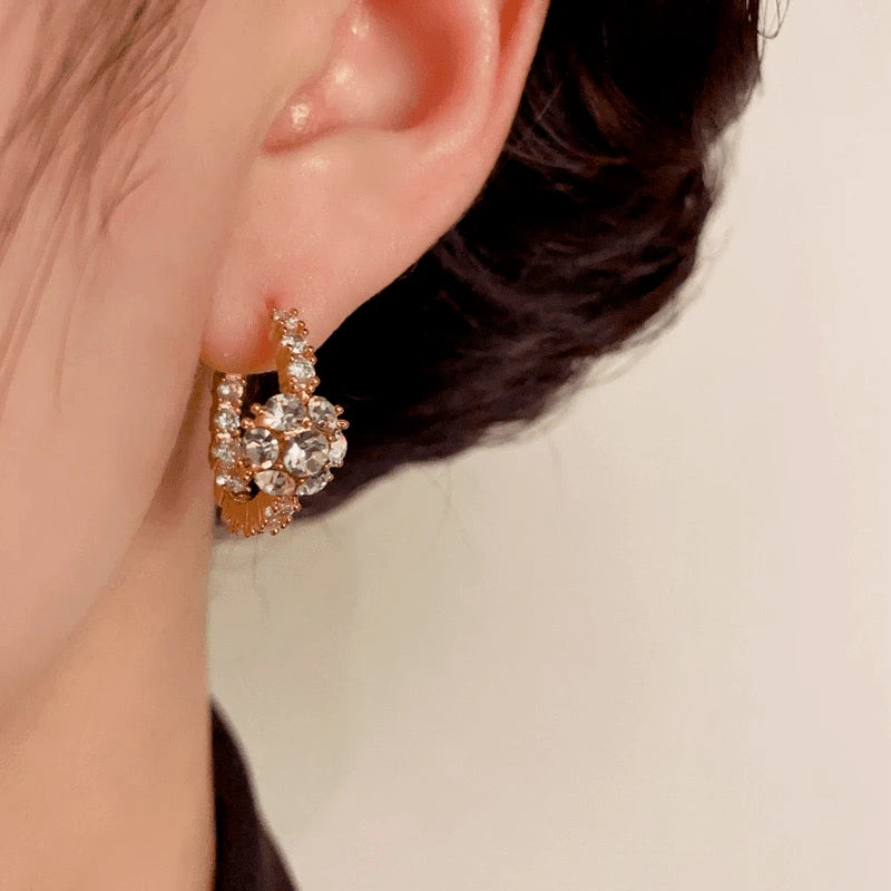 Close-up detail of the sparkling zircons and plating on the Ball Hoop Earrings