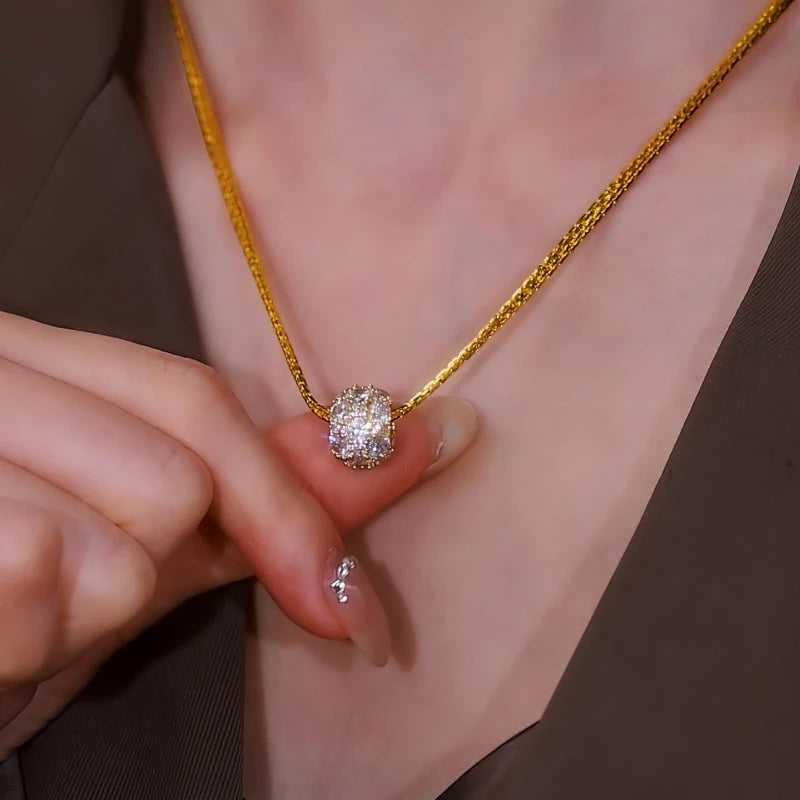 Close-up of the pendant and clasp on the Ball Pendant Necklace