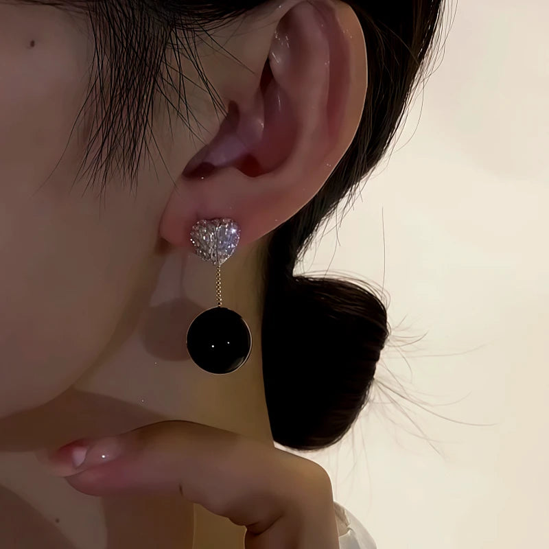 Close-up detail of the sparkling zircons and plating on the Black Pearl Earrings