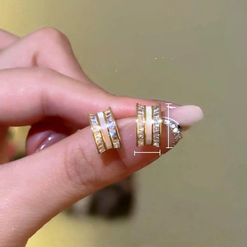 Model showcasing the dangle and style of the 14K Gold-Plated Zircon Diamond C-Shaped Earrings