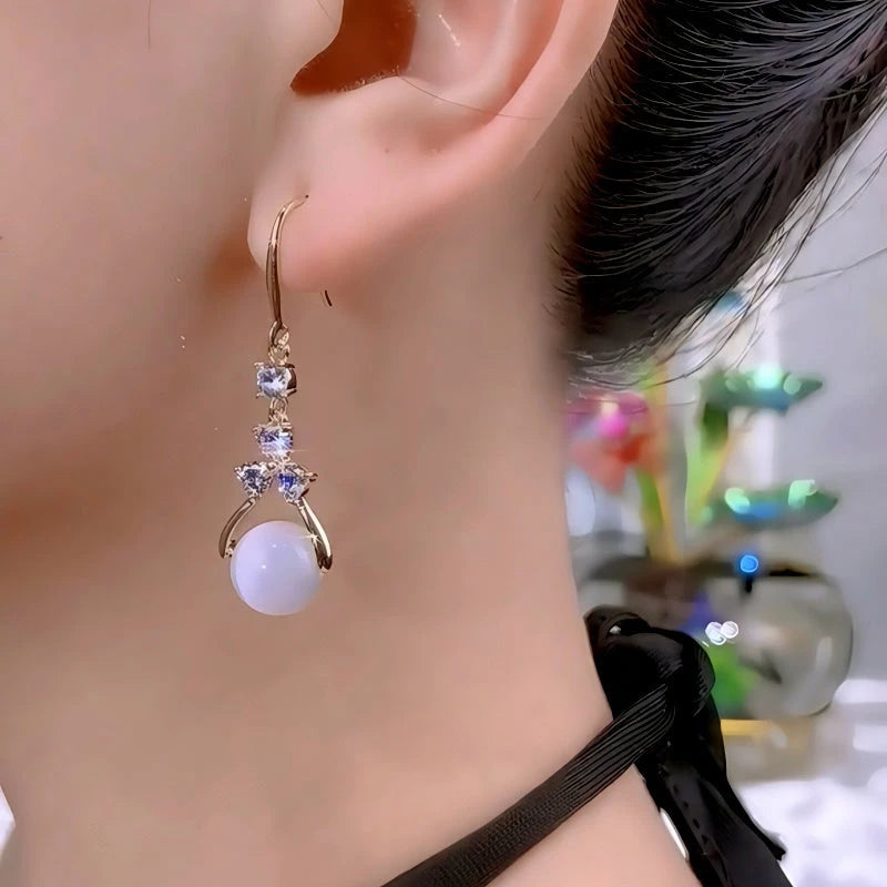 Close-up detail of the sparkling zircons and plating on the Cat's Eye Ear Hooks