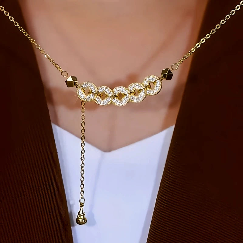 Detailed view of the 14K Gold-Plated Zircon Diamond Coin Tassel Necklace chain and pendant