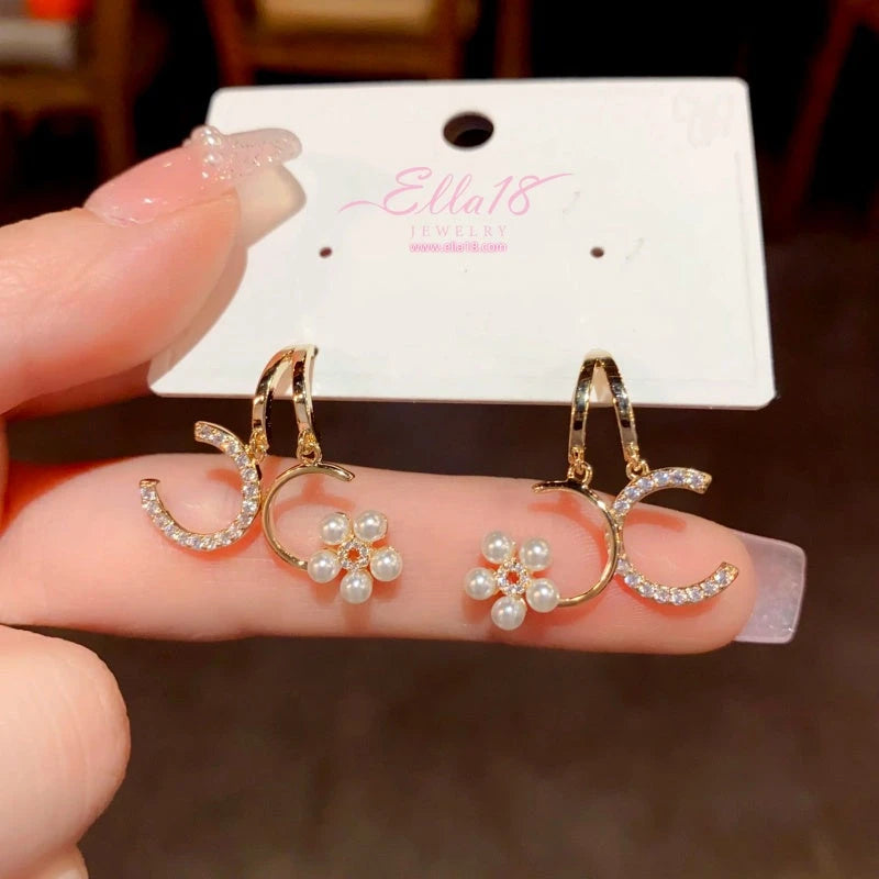 Close-up detail of the sparkling zircons and plating on the Floral Pearl Earrings