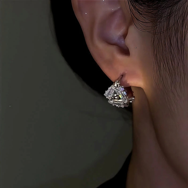Model showcasing the dangle and style of the 14K Gold-Plated Zircon Diamond Earrings