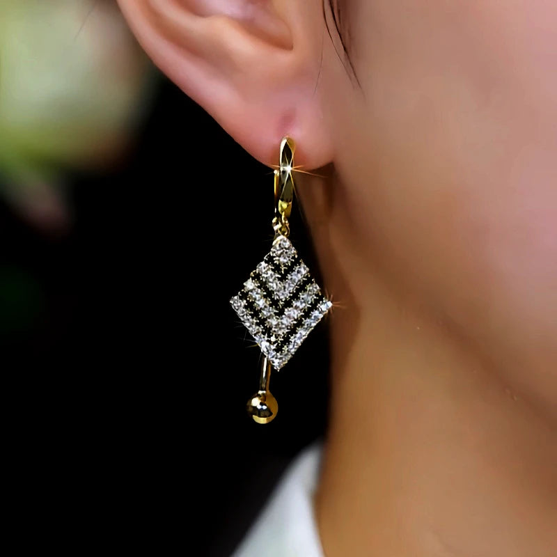Close-up detail of the sparkling zircons and plating on the Black and White Earrings