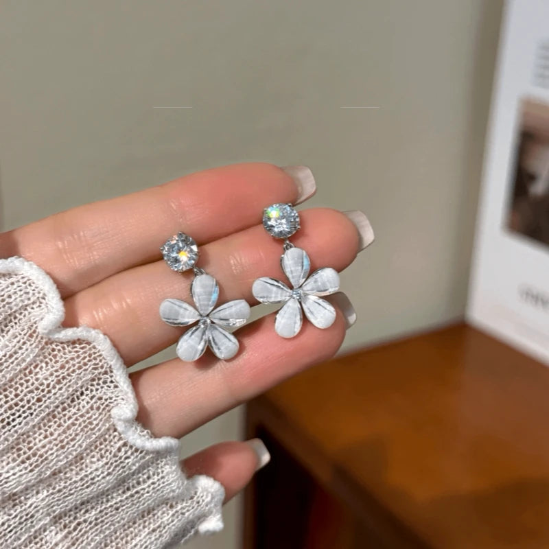 Angled view of the 14K Gold-Plated Zircon Diamond Flower Tassel Earrings