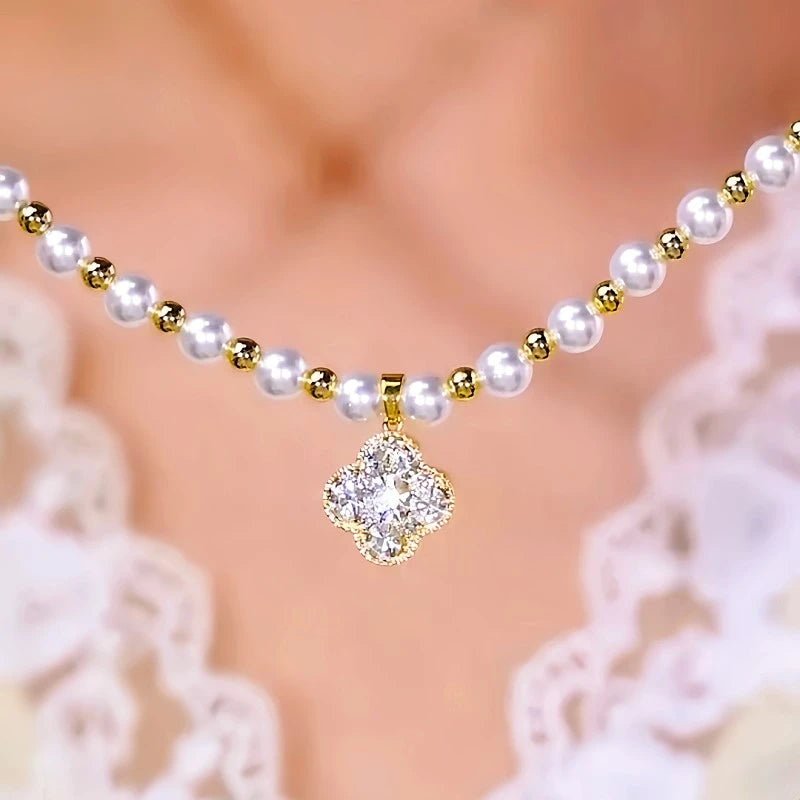Close-up of the pendant and clasp on the Clover Pearl Necklace