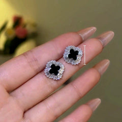 Model showcasing the dangle and style of the 14K Gold-Plated Zircon Diamond Four Leaf Stud Earrings