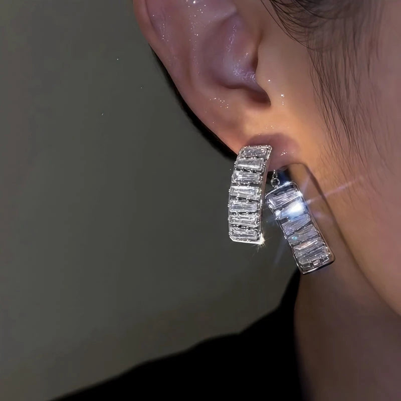 Model showcasing the dangle and style of the 14K Gold-Plated Zircon Diamond Front And Back Earrings