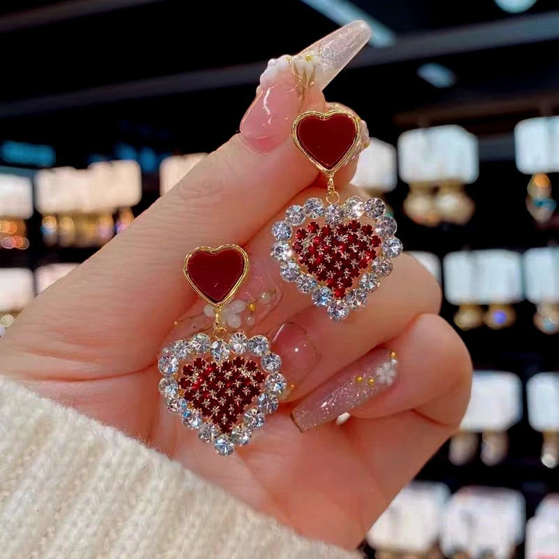 Angled view of the 14K Gold-Plated Zircon Diamond Heart Earrings