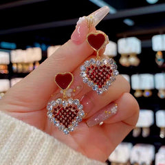 Angled view of the 14K Gold-Plated Zircon Diamond Heart Earrings