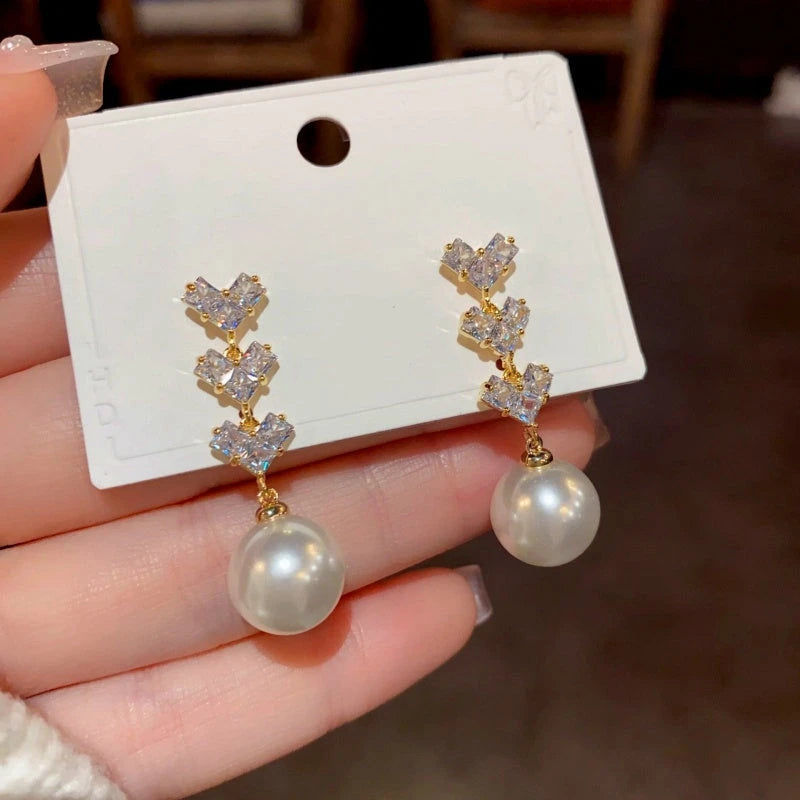 Close-up detail of the sparkling zircons and plating on the Pearl Tassel Earrings