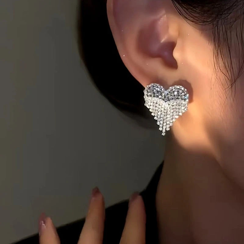 Close-up detail of the sparkling zircons and plating on the Heart Tassel Earrings