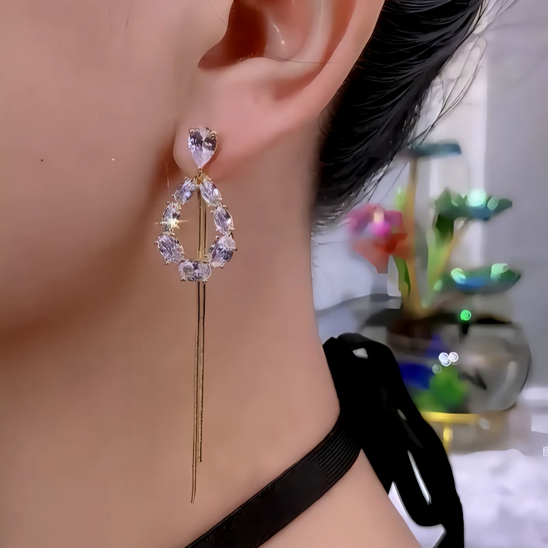 Close-up detail of the sparkling zircons and plating on the Heart Threader Earrings